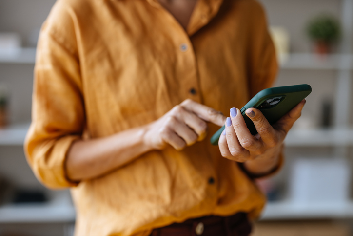 a woman using her phone indoors