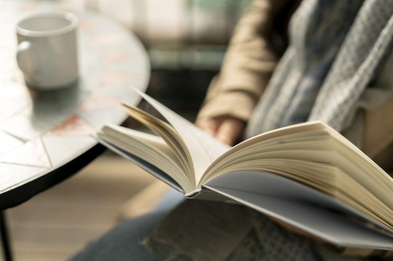 person reading in a coffee shop