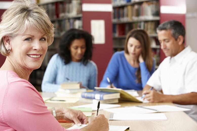 people in the library working together