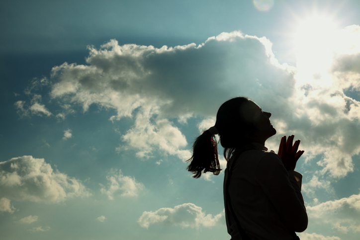 Woman basks in warmth and sunshine